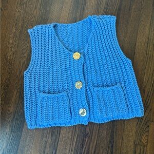 Blue knit vest with oversized gold buttons